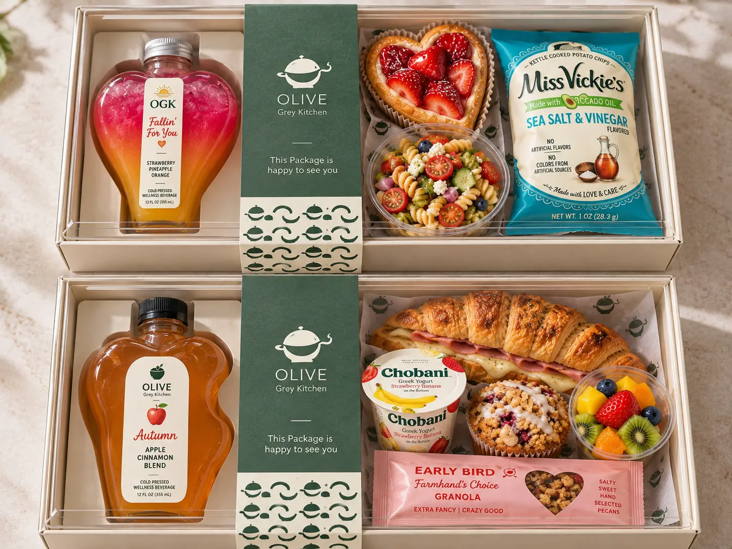 Breakfast box with croissant sandwich, yogurt, muffin, fruit cup and apple juice