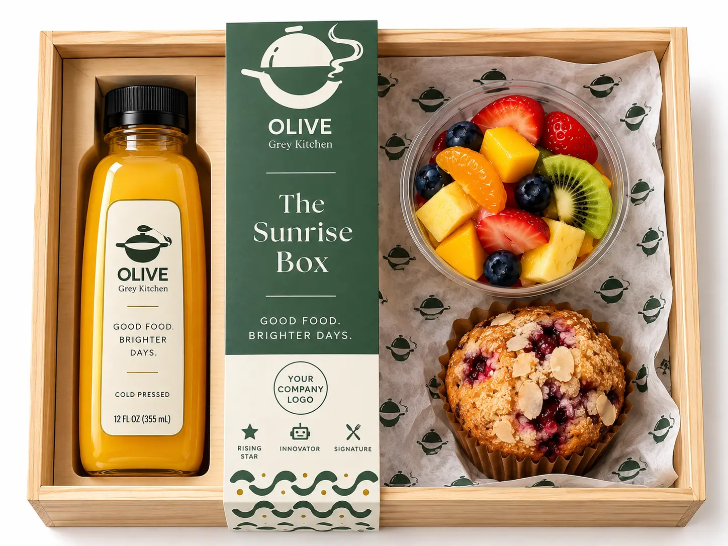The Sunrise Box: cold-pressed juice, fresh fruit cup and a muffin in a wooden box with an Olive Grey Kitchen sleeve